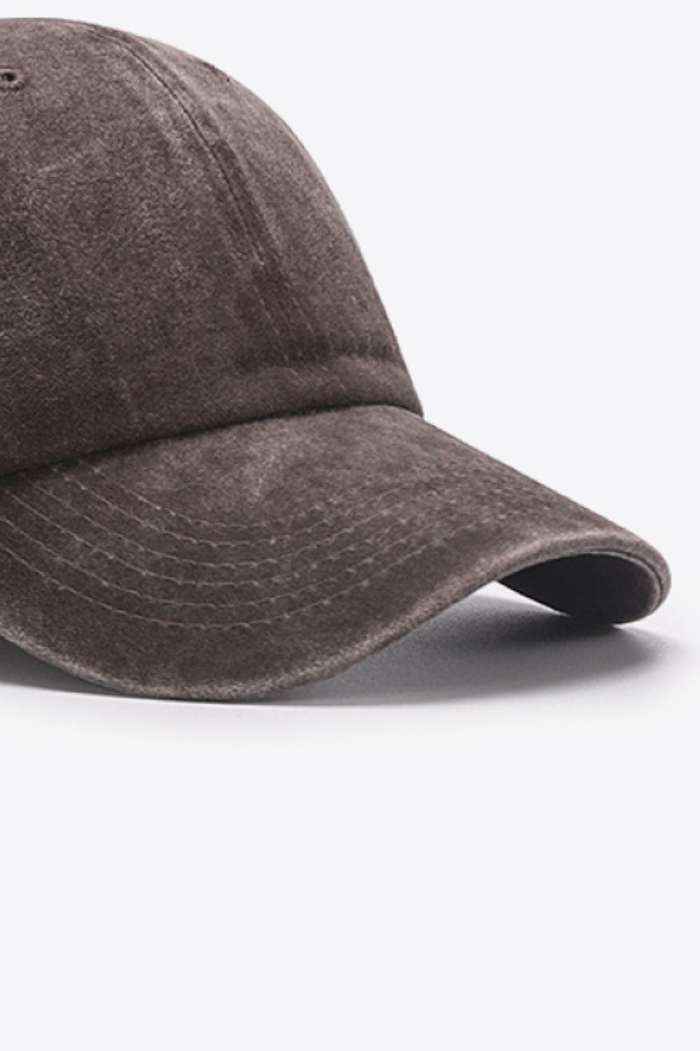 Washed cotton baseball cap in brown with stitched brim detail.