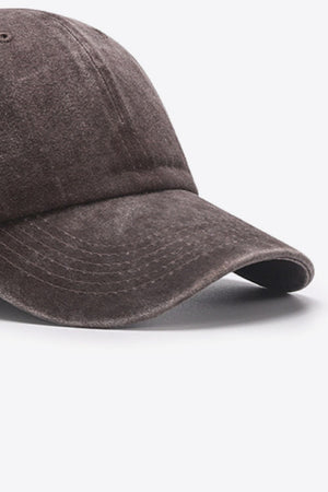 Washed cotton baseball cap in brown with stitched brim detail.