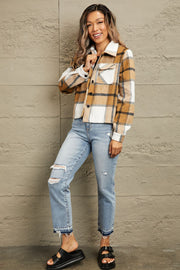 Camel plaid shacket with contrast collar, buttoned front, and chest pockets.