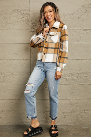 Camel plaid shacket with contrast collar, buttoned front, and chest pockets.