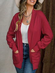 Deep red textured knit open-front cardigan with pockets and ribbed cuffs.