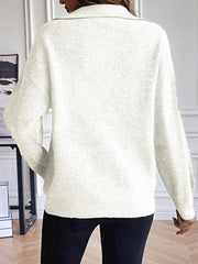Cream zip-up knit sweater with contrast collar and ribbed cuffs and hem.