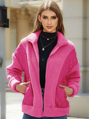 Pink quilted zip jacket with sherpa panels and a stand-up collar.