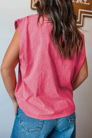 Deep rose cotton tank top with a relaxed fit and cap sleeves, styled with jeans.