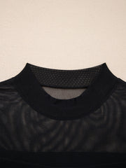Black sheer mesh t-shirt with mock neck and cap sleeves.