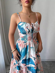 Tropical floral maxi dress with tie front and tiered skirt.