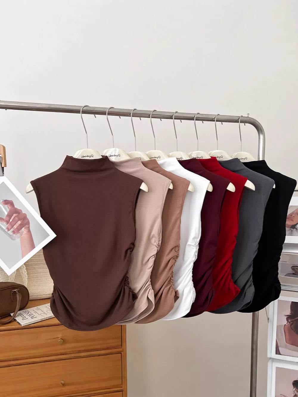 Textured ruching mock neck tank top in multiple colors with draped detail.