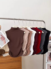 Textured ruching mock neck tank top in multiple colors with draped detail.