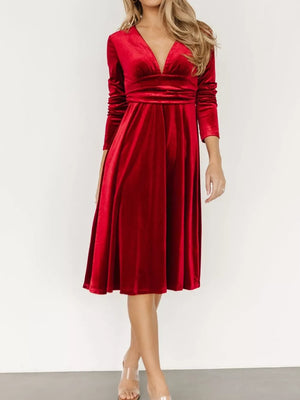 Red velvet midi dress with V-neck, long sleeves, and a-line skirt.