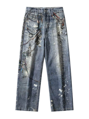 Men's wide-leg jeans in dusty blue denim with chain print and paint splatters.