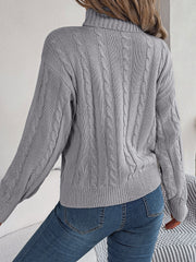 Dark Gray cable knit turtleneck sweater with voluminous sleeves and ribbed cuffs.