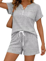 Light gray ribbed knit loungewear set with henley neckline, pocketed top, and drawstring shorts.