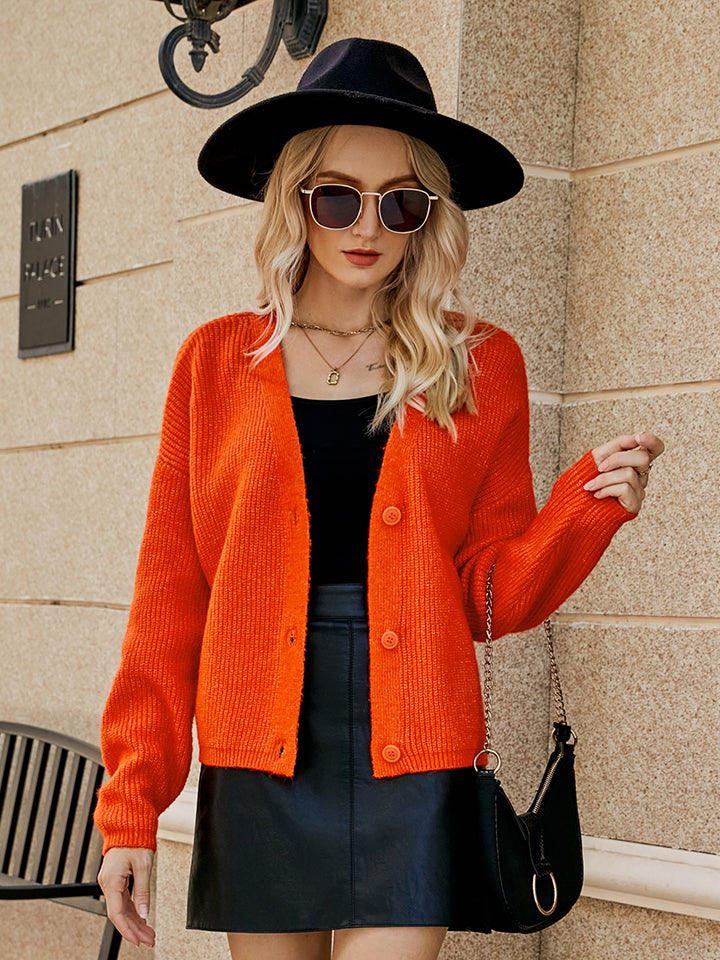 Orange-Red textured button-down knit cardigan with a relaxed fit.