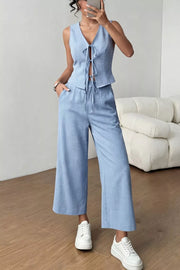 Light blue linen blend vest with tie front and wide leg cropped pants.