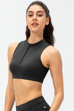 Black high-neck zip-front active crop top with sleeveless design.