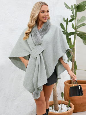Gray faux fur collar wrap poncho with tie detail and pom-pom trim.
