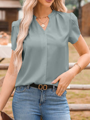 Notched neckline petal sleeve blouse in light gray with button detail and subtle pleating.