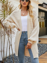 Ivory open knit slouchy cardigan with balloon sleeves and ribbed details.