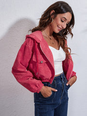 Cropped corduroy hooded jacket in hot pink with zip front and drawstring hood.