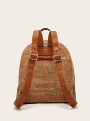 Cork backpack with adjustable brown straps and a colorful embroidered side panel.