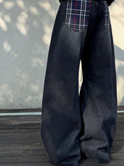Men's dark grey vintage wash baggy jeans with plaid back pocket details.