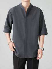 Dark gray oversized Mandarin collar half-sleeve shirt with button-down front.