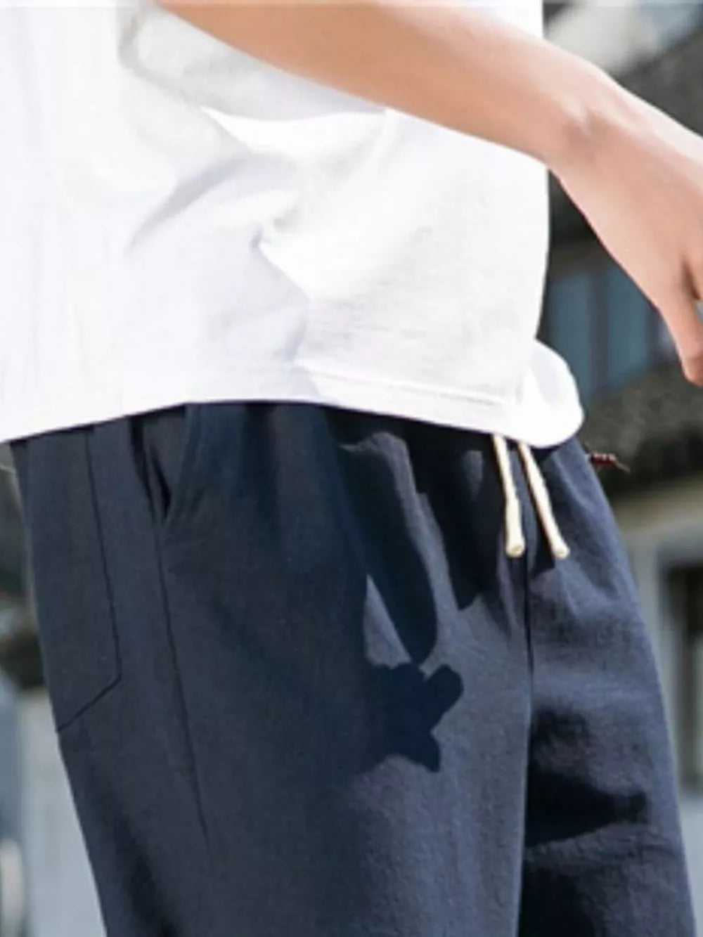 Navy blue men's sweatpants with drawstring and pockets