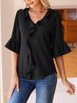 Black maternity shirt with cascading ruffles, V-neck, and 3/4 bell sleeves.