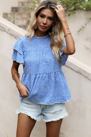 Sky blue floral peplum blouse with ruffled short sleeves and mock neck.