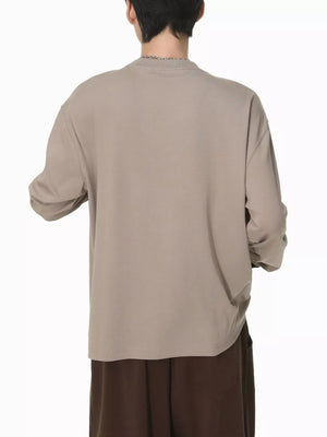 Men's relaxed fit long sleeve t-shirt in coffee color cotton, shown from the back.