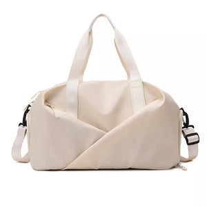 Beige nylon travel bag with top handles and adjustable shoulder strap.
