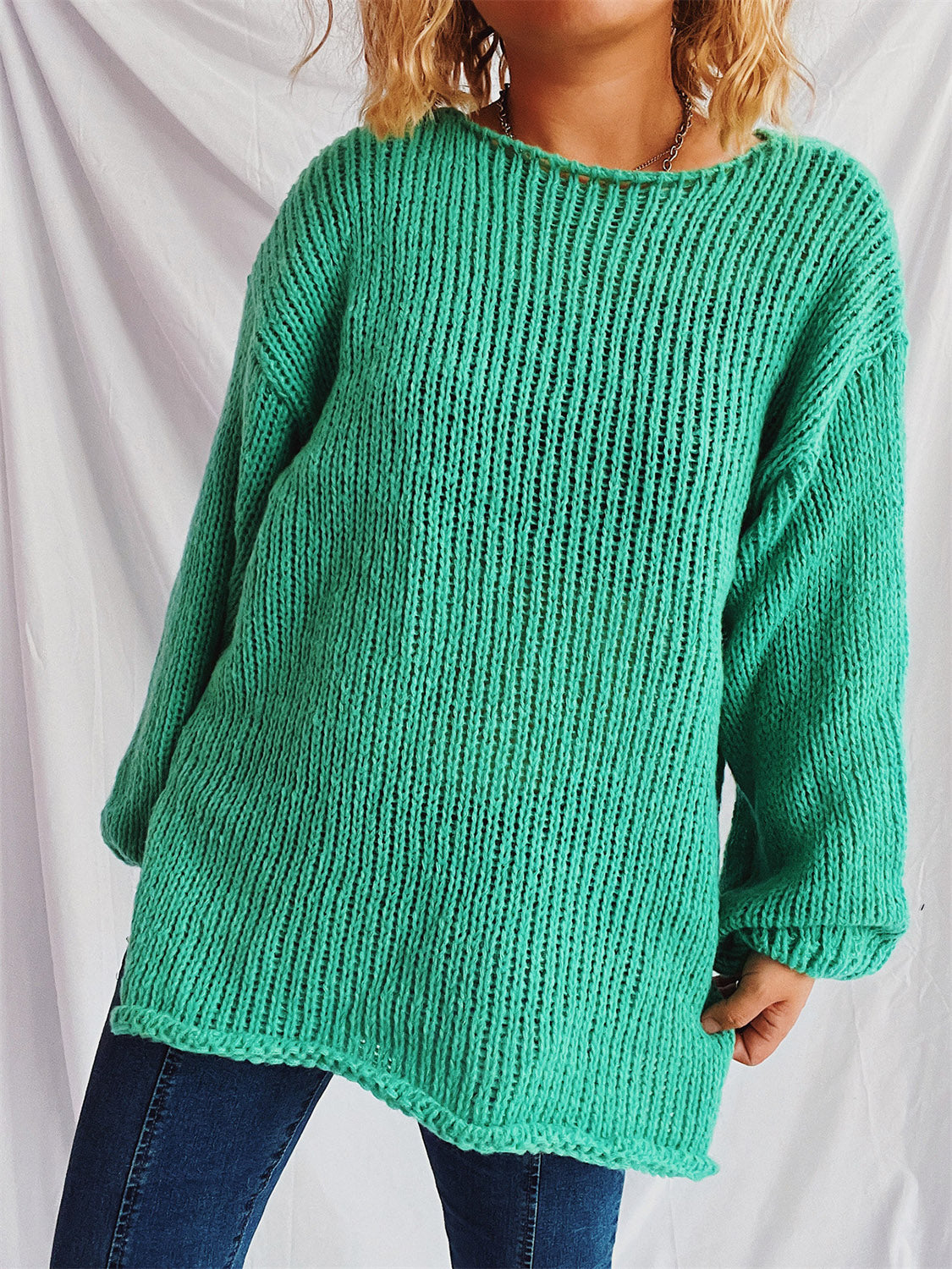 Turquoise open-knit slouchy boatneck pullover sweater with ribbed texture and relaxed fit.