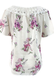 White floral blouse with lace yoke and short sleeves