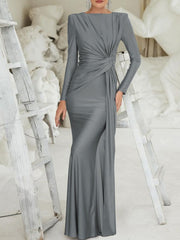 Gray ruched knot front maxi dress with long sleeves and a draped skirt.
