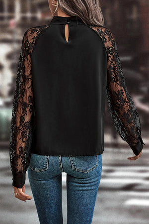 Black lace sleeve blouse with keyhole neckline and button closure at back neck.