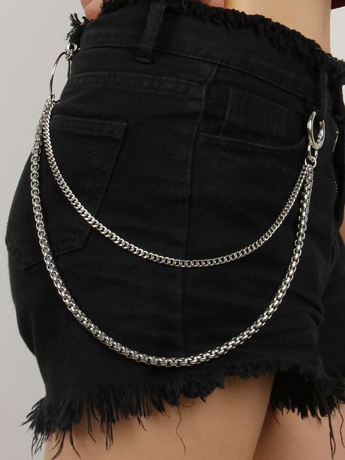 Silver double-strand chain pant accessory with lobster clasp and O-ring detail.