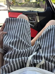 Men's black and white patterned waffle-knit chino shorts with drawstring.