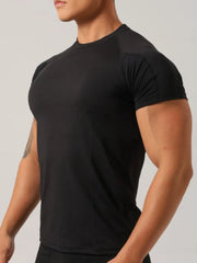 Black crew neck activewear t-shirt with short sleeves and a comfortable fit.