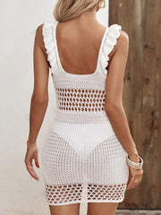 White open-knit crochet mini dress with ruffle straps and cutout detail.