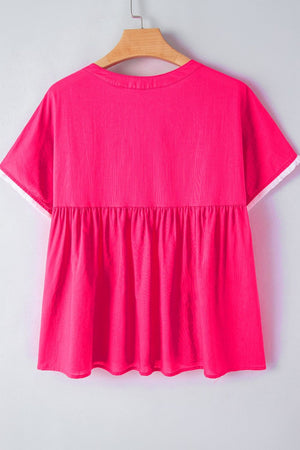 Strawberry pink babydoll blouse with white trim and gathered waist