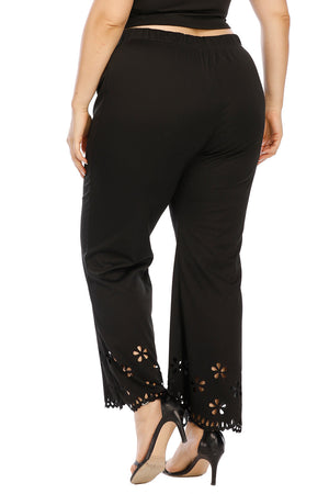 Black flare trousers with floral hem detail and scalloped trim.