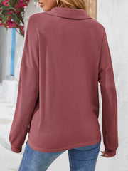 Waffle knit henley blouse in cerise with a collar and long sleeves.