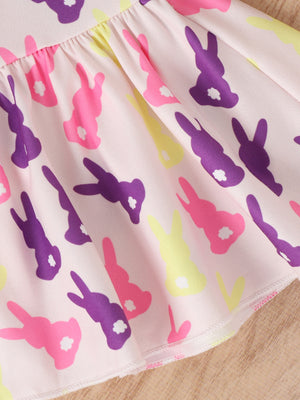 Baby set with pink fabric and a whimsical bunny graphic in purple, pink, and yellow.
