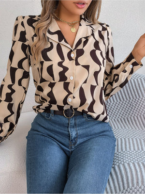 Camel abstract wave print silk-touch blouse with button front and collared neckline.