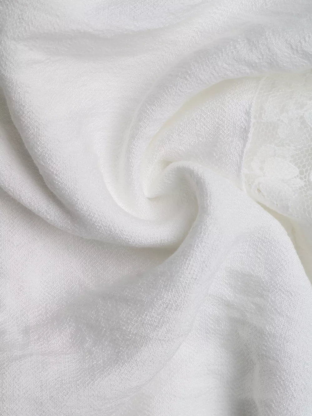 White smocked mini dress with eyelet hem detail