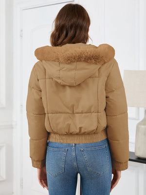 Camel puffer jacket with faux fur trimmed hood and elastic cuffs.