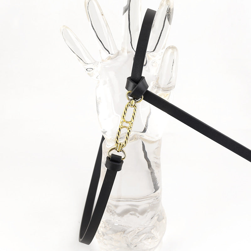 Black cowhide leather skinny belt with gold chain detail and buckle.