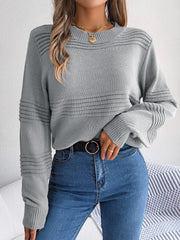 Dark gray acrylic knit sweater with ribbed yoke and sleeves, crewneck, and long sleeves.