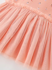 Peach tulle layered baby dress with a ruffled crew neck and dancer print.