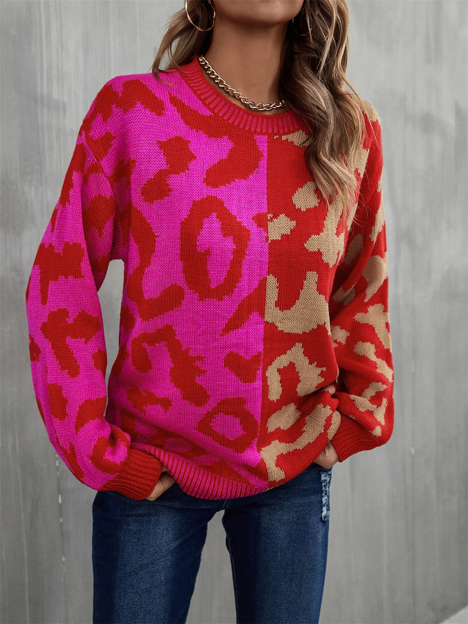 Split leopard knit sweater in rose/red with statement sleeves and crew neck.